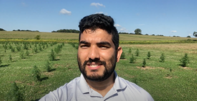 Shuresh Ghimire in hemp field in eastern Connecticut